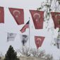 Turkish flags and banners depicting Mustafa Kemal Ataturk, the founder of modern Turkey, decorate a street outside the United States embassy in Ankara, Turkey, Sunday, April 25, 2021. Turkey&#x27;s foreign ministry has summoned the U.S. Ambassador in Ankara to protest the U.S. decision to mark the deportation and killing of Armenians during the Ottoman Empire as &amp;quot;genocide.&amp;quot; On Saturday, U.S. President Joe Biden followed through on a campaign promise to recognize the events that began in 1915 and killed an estimated 1.5 million Ottoman Armenians as genocide. (AP Photo/Burhan Ozbilici)