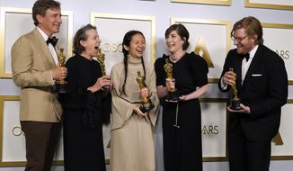Producers Peter Spears, from left, Frances McDormand, Chloe Zhao, Mollye Asher and Dan Janvey, winners of the award for best picture for &amp;quot;Nomadland,&amp;quot; pose in the press room at the Oscars on Sunday, April 25, 2021, at Union Station in Los Angeles. (AP Photo/Chris Pizzello, Pool)