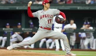 Los Angeles Angels starting pitcher Shohei Ohtani works the first inning against the Texas Rangers during a baseball game on Monday, April 26, 2021, in Arlington, Texas. (AP Photo/Richard W. Rodriguez)