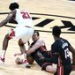 Miami Heat guard Goran Dragic, right, falls to the court as Chicago Bulls forward Thaddeus Young (21) defends during the second half of an NBA basketball game, Monday, April 26, 2021, in Miami. (AP Photo/Lynne Sladky)