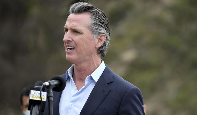 FILE - In this April 23, 2021, file photo, California Gov. Gavin Newsom speaks during a press conference about the newly reopened Highway 1 at Rat Creek near Big Sur, Calif. Organizers of the recall effort against Gov. Newsom collected enough valid signatures to qualify for the ballot. The California secretary of state’s office announced Monday, April 26, 2021 that more than 1.6 million signatures had been verified, about 100,000 more than needed to force a vote on the first-term Democrat. (AP Photo/Nic Coury, File)