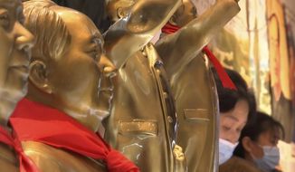 Souvenirs of the late Communist leader Mao Zedong are sold at a gift shop at the Jinggangshan Revolution Museum in Jinggangshan in southeastern China&#39;s Jiangxi province, on April 8, 2021. On the hundredth anniversary of the Chinese Communist Party, tourists in China are flocking to historic sites and making pilgrimages to party landmarks. (AP Photo/Emily Wang)