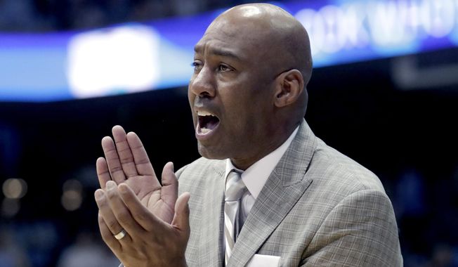 Wake Forest head coach Danny Manning cheers on his team against North Carolina during the second half of an NCAA college basketball game in Chapel Hill, N.C., in this Tuesday, March 3, 2020, file photo. Maryland hired former Wake Forest coach Danny Manning as an assistant on Mark Turgeon’s staff on Monday, April 26, 2021, reuniting a couple of old college teammates. (AP Photo/Chris Seward, File) **FILE**
