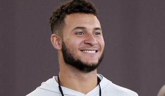 FILE - Caleb Farley smiles during Virginia Tech NFL football pro day in Blacksburg, Va., in this Friday, March 26, 2021, file photo. Farley is a possible first round pick in the NFL Draft, April 19-May 1, 2021, in Cleveland. (AP Photo/Matt Gentry, File)