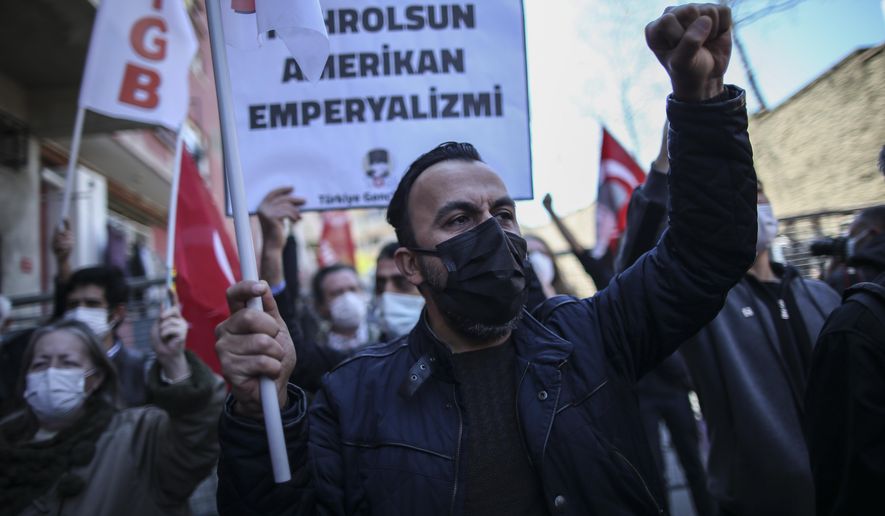 Supporters of the Turkey Youth Union chant slogans during a protest against U.S. President Joe Biden&#39;s statement, outside the U.S. consulate, in Istanbul, Monday, April 26, 2021. On Saturday Biden followed through on a campaign promise to recognize the events that began in 1915 and killed an estimated 1.5 million Ottoman Armenians as genocide. The statement was carefully crafted to say the deportations, massacres and death marches took place in the Ottoman Empire. Turkey rejects the use of the word, saying both Turks and Armenians were killed in the World War I-era fighting, and has called for a joint history commission to investigate. (AP Photo/Emrah Gurel)