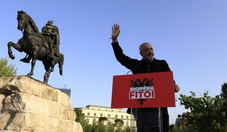 Albania&#39;s Prime Minister Edi Rama waves to his supporters during a rally in Tirana, Albania, Tuesday, April 27, 2021. Albania&#39;s left-wing Socialist Party has secured a third consecutive mandate in a parliamentary election, winning a majority of seats in parliament, Prime Minister Edi Rama said on Tuesday. (AP Photo/Hektor Pustina)