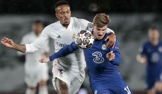 Chelsea&#39;s Timo Werner vies for the ball with Real Madrid&#39;s Eder Militao, left, during the Champions League semifinal first leg soccer match between Real Madrid and Chelsea at the Alfredo di Stefano stadium in Madrid, Spain, Tuesday, April 27, 2021. (AP Photo/Bernat Armangue)