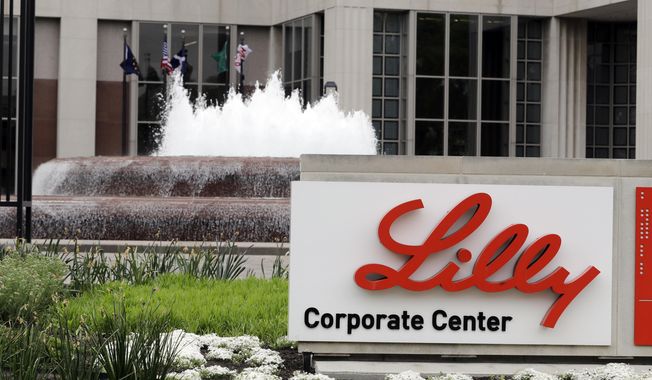 FILE- In this April 26, 2017, file photo shows the Eli Lilly and Co. corporate headquarters in Indianapolis. Eli Lilly fell well short of Wall Street’s first-quarter expectations, Tuesday, April 27, 2021, and the drugmaker chopped the top end of its earnings forecast due to lower demand for COVID-19 treatments.   (AP Photo/Darron Cummings, File)