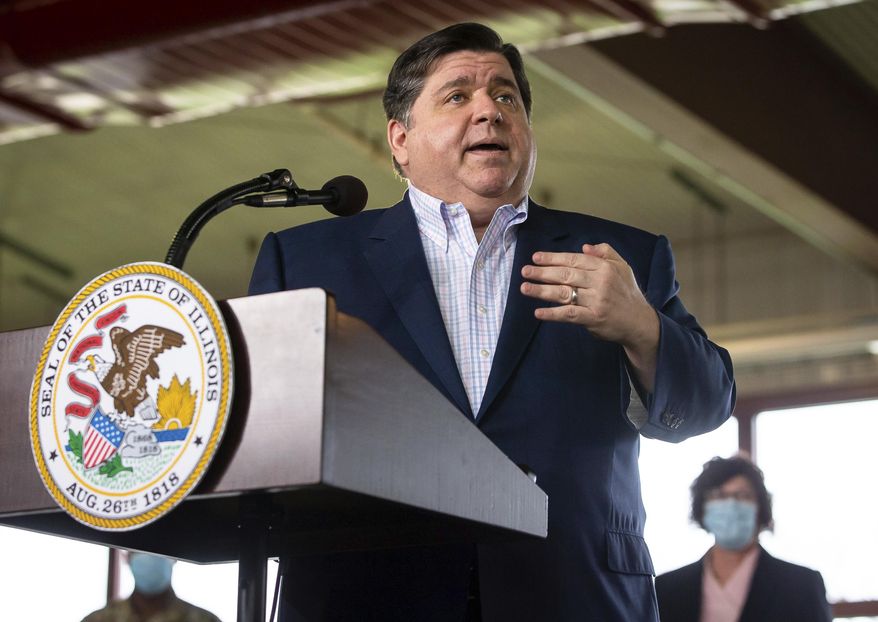 FILE - In this March 24, 2021 file photo, Illinois Gov. JB Pritzker answers questions at the Illinois State Fairgrounds in Springfield, Ill. Gov. Pritzker on Tuesday, April 27, 2021, signed legislation to make health care more accessible and equitable for people of color. (Justin L. Fowler/The State Journal-Register via AP, File)