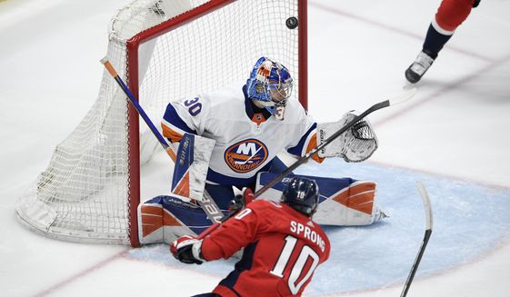 Washington Capitals right wing Daniel Sprong (10) scores a goal past New York Islanders goaltender Ilya Sorokin (30) during the first period of an NHL hockey game Tuesday, April 27, 2021, in Washington. (AP Photo/Nick Wass)
