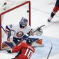 Washington Capitals right wing Daniel Sprong (10) scores a goal past New York Islanders goaltender Ilya Sorokin (30) during the first period of an NHL hockey game Tuesday, April 27, 2021, in Washington. (AP Photo/Nick Wass)