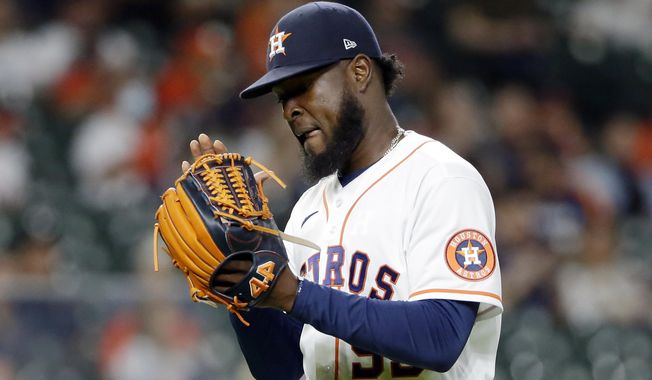 Houston Astros starting pitcher Cristian Javier reacts as he leaves the mound after striking out Seattle Mariners&#x27; Sam Haggerty during the seventh inning of a baseball game Tuesday, April 27, 2021, in Houston. (AP Photo/Michael Wyke)