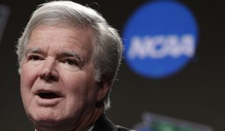 FILE - In this April 4, 2019, file photo, NCAA President Mark Emmert answers questions during a news conference at the Final Four college basketball tournament in Minneapolis. The NCAA Board of Governors voted Tuesday, April 27, 2021, to extend Emmert&#39;s contract by two years through 2025. Emmert’s contract was set to expire in 2023, but the board voted unanimously to extend his deal. (AP Photo/Matt York, File)