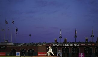 San Francisco Giants&#39; Anthony DeSclafani, center, pitches against the Colorado Rockies during the fourth inning of a baseball game in San Francisco, Monday, April 26, 2021. (AP Photo/Jeff Chiu)