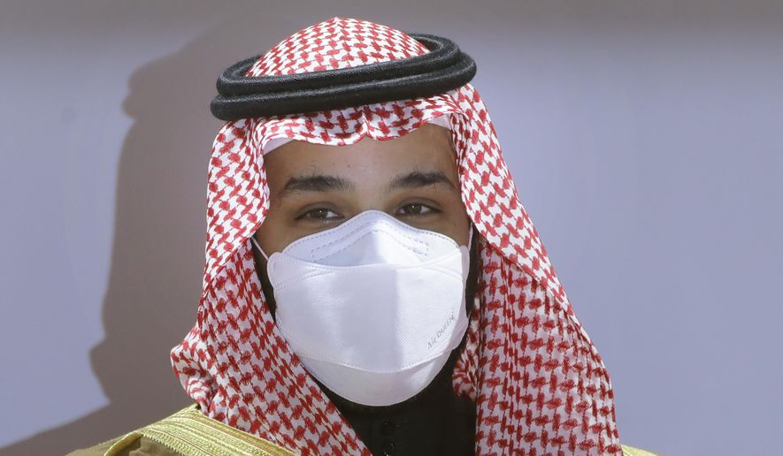 FILE - In this Feb. 20, 2021, file photo, Saudi Crown Prince Mohammed bin Salman wears a face mask to help curb the spread of the coronavirus as he attends the Saudi Cup award ceremony during the final race of the $20 million, the Saudi Cup, at King Abdul Aziz race track in Riyadh, Saudi Arabia. The crown prince laid out a vigorous defense of his domestic policies and the thinking behind his push to transform Saudi Arabia economically and socially during a wide-ranging interview broadcast across Saudi television channels late Tuesday, April 27, 2021.  (AP Photo/Amr Nabil, File)