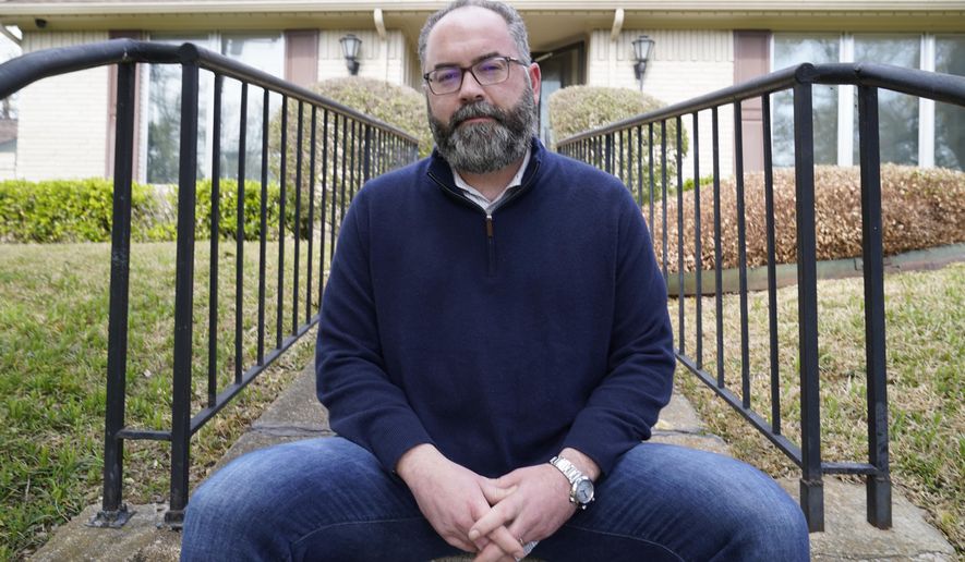 Attorney Mark Melton poses for a photo in front of his home in Dallas, Friday, April 2, 2021. Melton has formed a group made up of volunteer attorneys to help people avoid evictions if they can't pay rent due to the pandemic. (AP Photo/LM Otero)