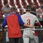 Philadelphia Phillies right fielder Bryce Harper, right, is helped off the field after getting hit by a pitch during the sixth inning of the team&#39;s baseball game against the St. Louis Cardinals on Wednesday, April 28, 2021, in St. Louis. (AP Photo/Joe Puetz)