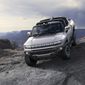 This photo provided by GMC shows the GMC Hummer EV, an electric pickup which will relaunch the Hummer brand. With lots of off-road potential and 1,000 horsepower on tap, the Hummer EV certainly makes a bold statement. (Courtesy of GMC via AP)