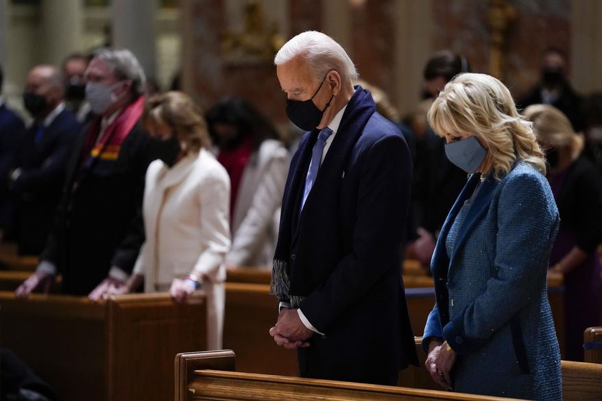 In this Wednesday, Jan. 20, 2021, photo, President-elect Joe Biden and his wife, Jill Biden, attend Mass at the Cathedral of St. Matthew the Apostle during Inauguration Day ceremonies in Washington. When U.S. Catholic bishops hold their next national meeting in June 2021, they’ll be deciding whether to send a tougher-than-ever message to President Joe Biden and other Catholic politicians: Don’t partake of Communion if you persist in public advocacy of abortion rights. (AP Photo/Evan Vucci) **FILE**