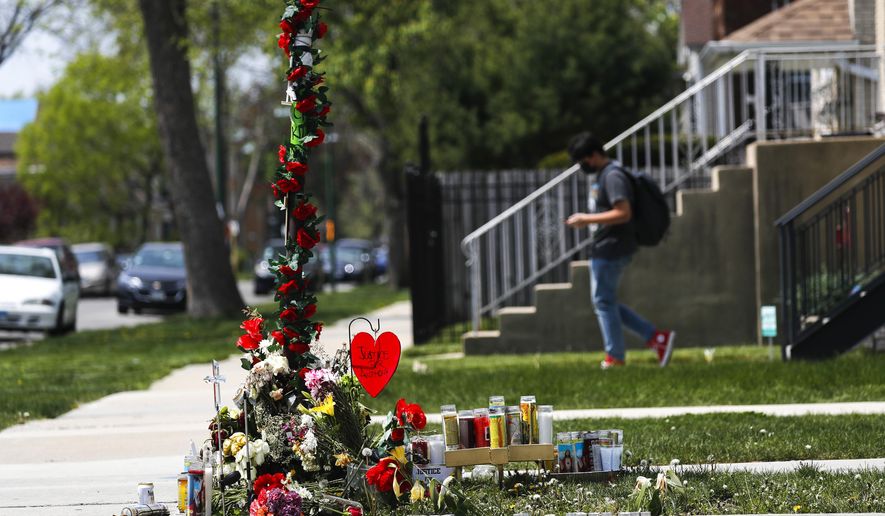 A memorial is set up near the site where 22-year-old Anthony Alvarez was shot several weeks ago during a foot pursuit by Chicago police in Chicago&#39;s Portage Park on Tuesday, April 27, 2021 in Chicago. Chicago’s independent police review board has released video of the 22-year-old Latino man who was shot in the back late last month during a foot chase.   (Jose M. Osorio /Chicago Tribune via AP)