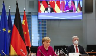 German Chancellor Angela Merkel attends virtual talks with Chinese Premier Li Keqiang as part of the Sixth German-Chinese Government Consultations, in Berlin, Germany April 28, 2021.  (Michele Tantussi/Pool via AP)
