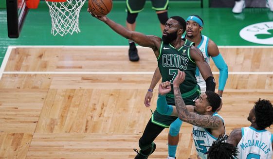 Boston Celtics guard Jaylen Brown (7) drives to the basket during the first half of an NBA basketball game against the Charlotte Hornets, Wednesday, April 28, 2021, in Boston. (AP Photo/Charles Krupa)