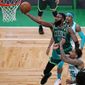 Boston Celtics guard Jaylen Brown (7) drives to the basket during the first half of an NBA basketball game against the Charlotte Hornets, Wednesday, April 28, 2021, in Boston. (AP Photo/Charles Krupa)