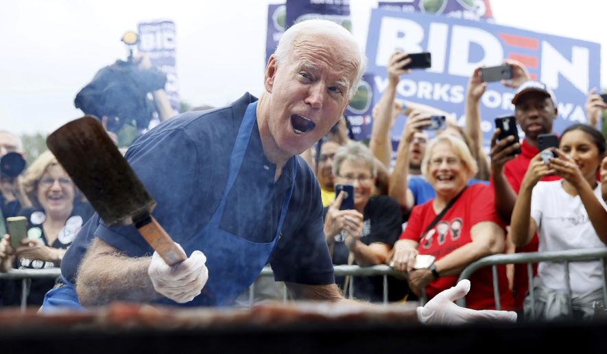FILE - In this Sept. 21, 2019, file photo when former Vice President Joe Biden was running for president, Biden works the grill during the Polk County Democrats Steak Fry in Des Moines, Iowa. President Joe Biden spent only a weekend as the &amp;quot;Hamburglar&amp;quot; in the conservative media world, but the incident illustrated the speed at which a false and damaging story can spread. The Daily Mail wrote about things that could potentially be in a Biden climate change plan, and cited an academic study that mentioned reductions in greenhouse gases that could be achieved with limits on beef consumption. (AP Photo/Charlie Neibergall)