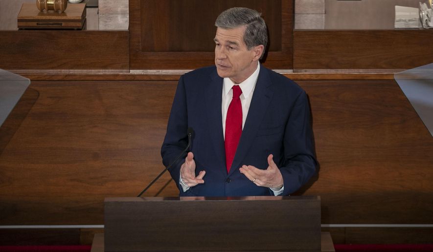 North Carolina Gov. Roy Cooper delivers his State of the State address before a joint session of the North Carolina House and Senate, Monday, April 26, 2021, in Raleigh, N.C. (Robert Willett/The News & Observer via AP)