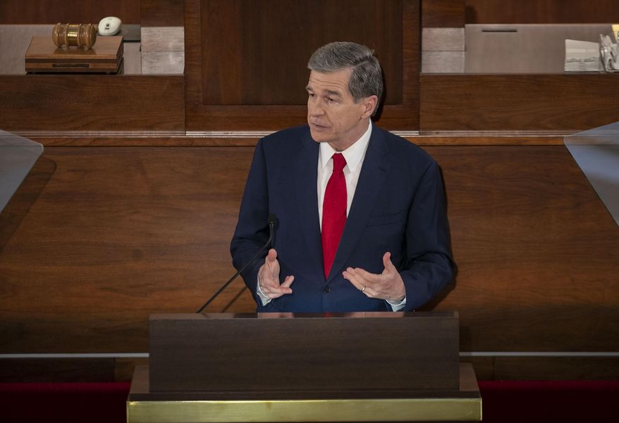 North Carolina Gov. Roy Cooper delivers his State of the State address before a joint session of the North Carolina House and Senate, Monday, April 26, 2021, in Raleigh, N.C. (Robert Willett/The News & Observer via AP)