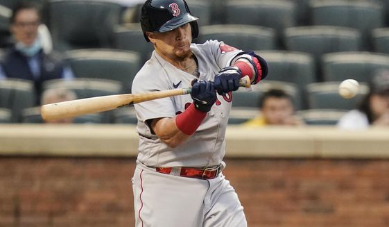 Boston Red Sox&#39;s Christian Vazquez hits an RBI double during the second inning of a baseball game against the New York Mets Wednesday, April 28, 2021, in New York. (AP Photo/Frank Franklin II)