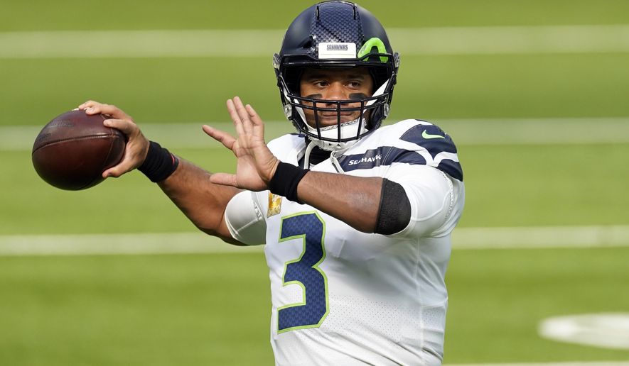 FILE - In this Sunday, Nov. 15, 2020 file photo, Seattle Seahawks quarterback Russell Wilson (3) warms up before an NFL football game against the Los Angeles Rams in Inglewood, Calif. Seattle Seahawks coach Pete Carroll and general manager John Schneider spend Wednesday, April 28, 2021 talking about their relationship with their starting quarterback, the result of months of silence on the subject and the fact they have just three picks in the NFL draft. (AP Photo/Ashley Landis, File)
