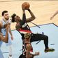 Portland Trail Blazers&#39; Nassir Little (9) drives against Memphis Grizzlies defenders in the second half of an NBA basketball game Wednesday, April 28, 2021, in Memphis, Tenn. (AP Photo/Mark Humphrey)