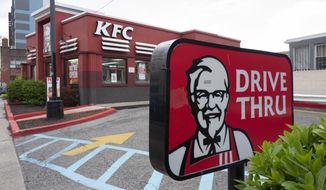 A KFC restaurant is open, Wednesday, April 21, 2021, in New York.  Yum Brands’ first-quarter profit more than tripled from a year ago, while sales were bolstered by strong performances from its Pizza Hut and KFC brands in the U.S. The parent company of KFC, Taco Bell and Pizza Hut earned $326 million, or $1.07 per share, for the period ended March 31.  (AP Photo/Mark Lennihan)