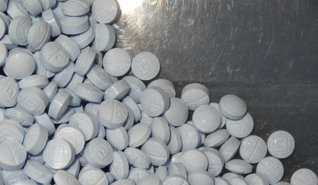 This undated file photo provided by the U.S. Attorney&#x27;s Office for Utah and introduced as evidence at a trial shows fentanyl-laced fake oxycodone pills collected during an investigation. (U.S. Attorneys Office for Utah via AP, File)