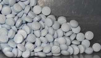 This undated file photo provided by the U.S. Attorney&#39;s Office for Utah and introduced as evidence at a trial shows fentanyl-laced fake oxycodone pills collected during an investigation.  (U.S. Attorneys Office for Utah via AP, File)