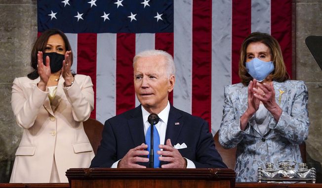 Vice President Kamala Harris and House Speaker Nancy Pelosi of Calif., stand and applaud as President Joe Biden addresses a joint session of Congress, Wednesday, April 28, 2021, in the House Chamber at the U.S. Capitol in Washington. (Melina Mara/The Washington Post via AP, Pool)