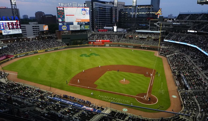 The Chicago Cubs play the Atlanta Braves at Truist Park in a baseball game Thursday, April 29, 2021, in Atlanta. The Braves announced they plan to expand attendance limits to full capacity beginning May 7. (AP Photo/John Bazemore)