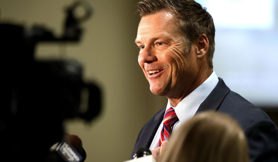 In this Aug. 4, 2020 file photo, Kris Kobach, a candidate for the Republican nomination for U.S. Senate, talks with reporters at his primary watch party in Leavenworth, Kan. (AP Photo/Orlin Wagner ,File)