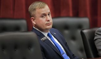 State Rep. Aaron von Ehlinger, R-Lewiston, listens as an alleged victim, identified as Jane Doe, offers testimony during a hearing before the Idaho Ethics and House Policy Committee, Wednesday, April 28, 2021, in the Lincoln Auditorium at the Idaho Statehouse in Boise, Idaho. Von Ehlinger was before the committee to face sexual misconduct allegations with a 19-year-old volunteer staff member during the current legislative session. (Darin Oswald/Idaho Statesman via AP)