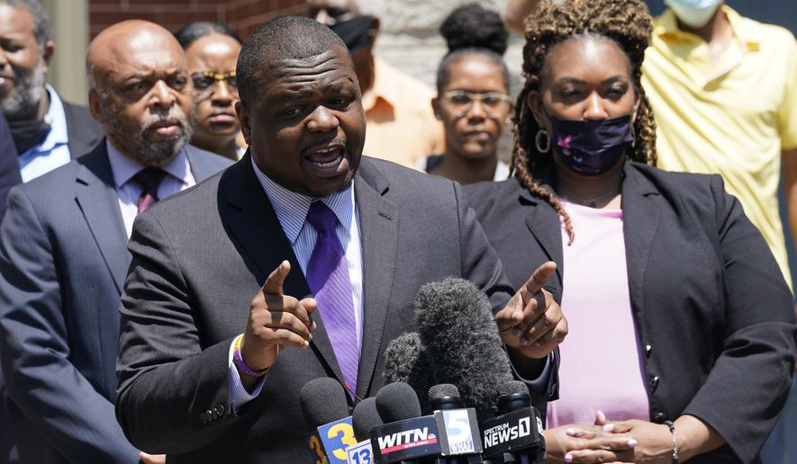 Attorney's for the family of Andrew Brown Jr., Harry Daniel, center, Chantel Cherry-Lassiter, right, and Wayne Kendall, left, make comments after a judge denied requests to release body camera video in the fatal shooting of Brown, in Elizabeth City, N.C., Wednesday, April 28, 2021. (AP Photo/Steve Helber)