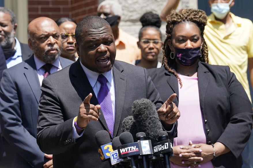 Attorney's for the family of Andrew Brown Jr., Harry Daniel, center, Chantel Cherry-Lassiter, right, and Wayne Kendall, left, make comments after a judge denied requests to release body camera video in the fatal shooting of Brown, in Elizabeth City, N.C., Wednesday, April 28, 2021. (AP Photo/Steve Helber)
