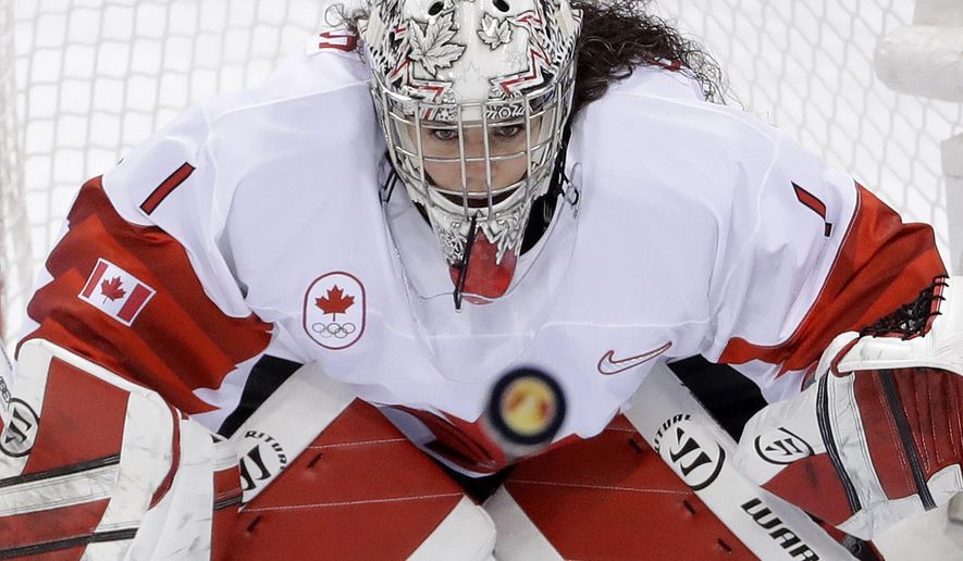 FILE - In this Thursday, Feb. 22, 2018 file photo, goalie Shannon Szabados (1), of Canada, stares at the flying puck during the second period of the women's gold medal hockey game against the United States at the 2018 Winter Olympics in Gangneung, South Korea. Tyler Tumminia is leaving the door open should members of the Professional Women’s Hockey Players’ Association ever want to reach out to the National Women’s Hockey League in a bid to thaw what’s been a chilly relationship. PWHPA member and former Canadian national team goalie Shannon Szabados was skeptical. “Until I see a league in North America that I would want my daughter to play in, my stance with the PWHPA remains united to create a better opportunity for future generations,” Szabados wrote in a text. (AP Photo/Matt Slocum, File)