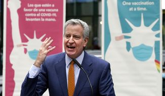In this Monday, April 12, 2021, file photo, New York Mayor Bill de Blasio delivers remarks in Times Square after he toured the grand opening of a Broadway COVID-19 vaccination site intended to jump-start the city&#39;s entertainment industry, in New York. (AP Photo/Richard Drew) ** FILE **