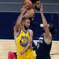 Golden State Warriors&#39; Stephen Curry (30) passes the ball as Minnesota Timberwolves&#39; Ricky Rubio (9) defends in the first half of an NBA basketball game, Thursday, April 29, 2021, in Minneapolis. (AP Photo/Jim Mone)