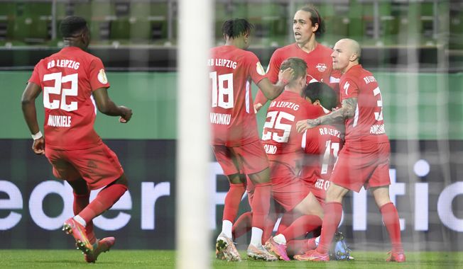 Leipzig&#x27;s Hwang Hee-chan, second right, celebrates with his teammates after scoring his side&#x27;s opening goal during the German soccer cup semifinal soccer match between Werder Bremen and RB Leipzig at the Weserstadion stadium in Bremen, Germany, Friday, April 30, 2021. (Carmen Jaspersen/Pool Photo via AP)