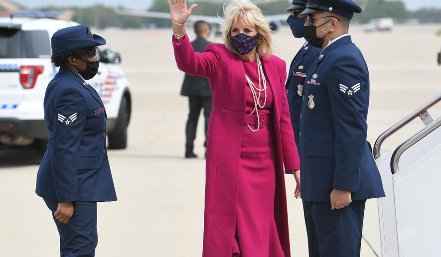 First lady Jill Biden makes her way to board a plane before departing from Andrews Air Force Base, Md., Wednesday, April 21, 2021. Biden is traveling to New Mexico and Arizona. (Mandel Ngan/ Pool via AP)