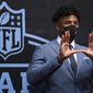 Miami edge rusher Gregory Rousseau appears on the red carpet at the Rock &amp;amp; Roll Hall of Fame before the NFL football draft Thursday, April 29, 2021, in Cleveland. (AP Photo/David Dermer, Pool)