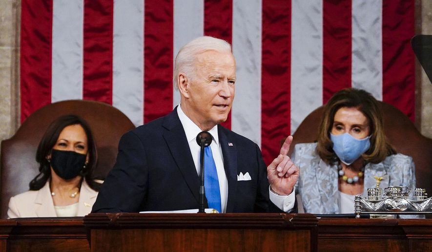 In this April 28, 2021, file photo President Joe Biden addresses a joint session of Congress in the House Chamber at the U.S. Capitol in Washington, as Vice President Kamala Harris, left, and House Speaker Nancy Pelosi of Calif., look on. (Melina Mara/The Washington Post via AP, Pool) ** FILE **