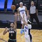 Orlando Magic guard Cole Anthony (50) hits the winning basket in front of Memphis Grizzlies forward Kyle Anderson (1) during the second half of an NBA basketball game, Saturday, May 1, 2021, in Orlando, Fla. (AP Photo/Phelan M. Ebenhack)